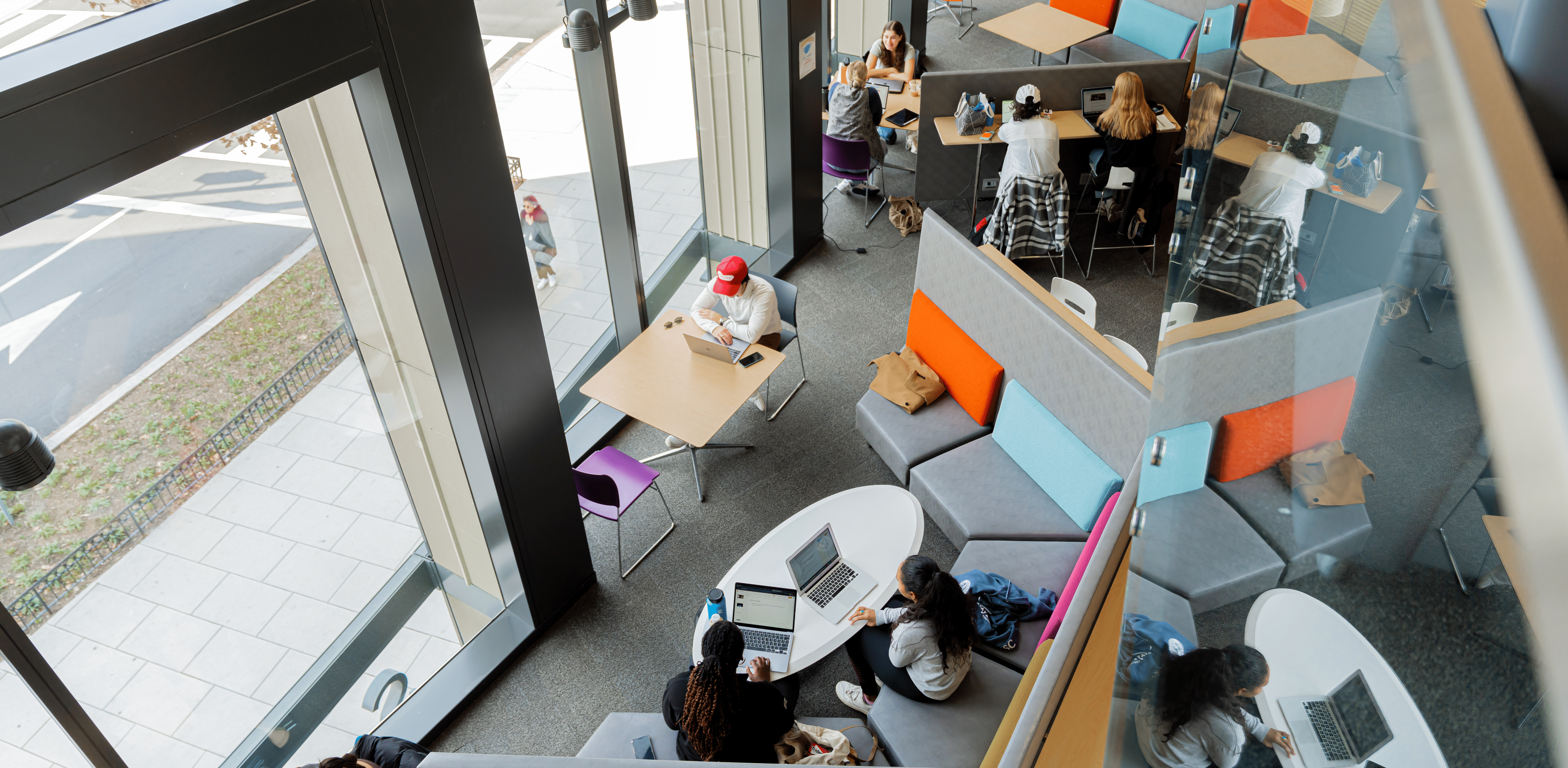 Students studying in a common space in the SPH building