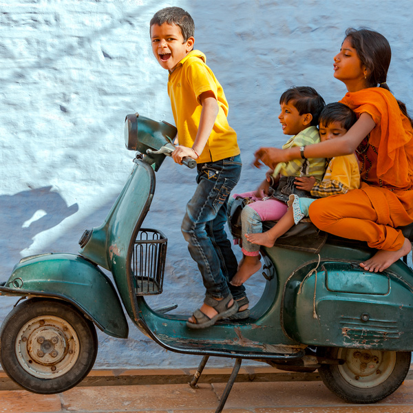 Children riding a scooter
