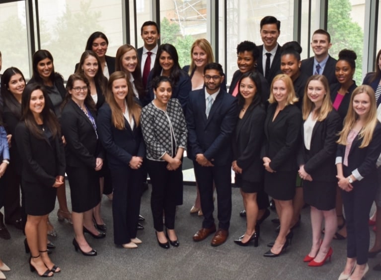 group of people posing in business attire 