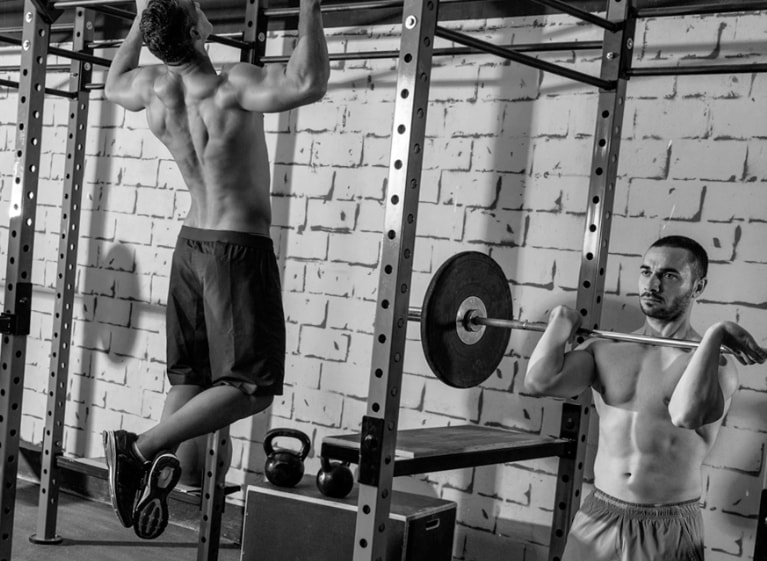 Two men working out in a gym