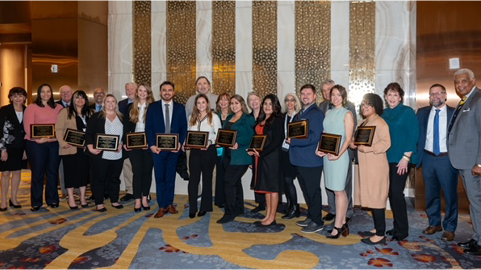 12 emerging health leaders with their awards