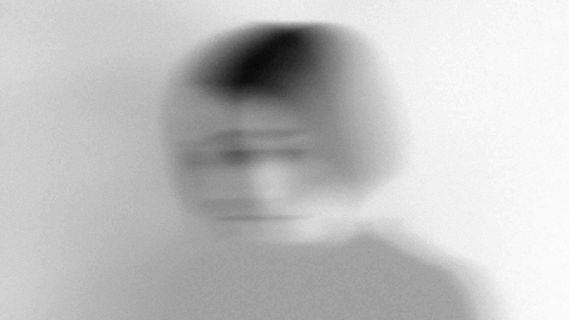 Blurry photo of a woman's face