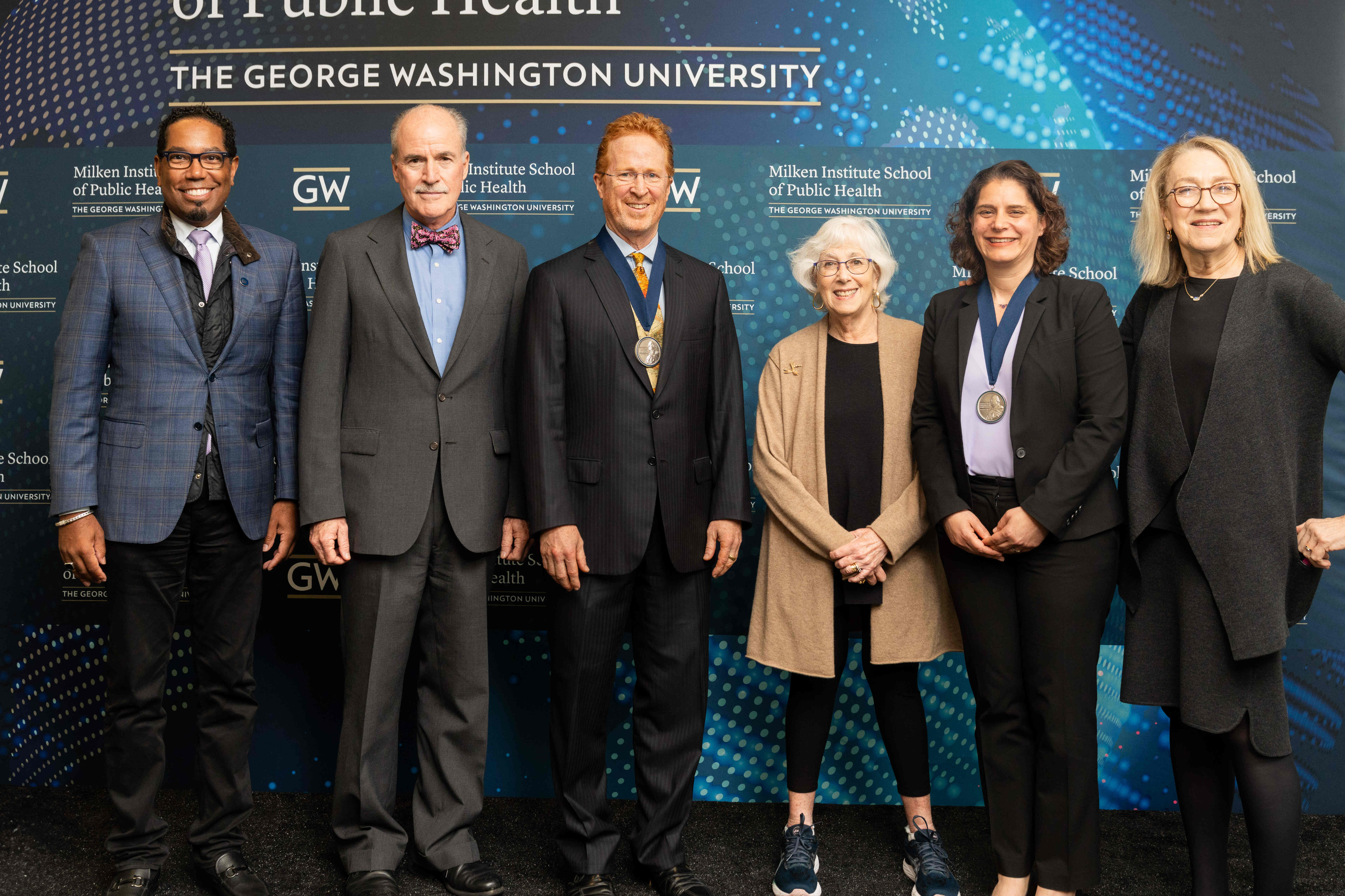 Photo of all the speakers and the two newly installed professors.
