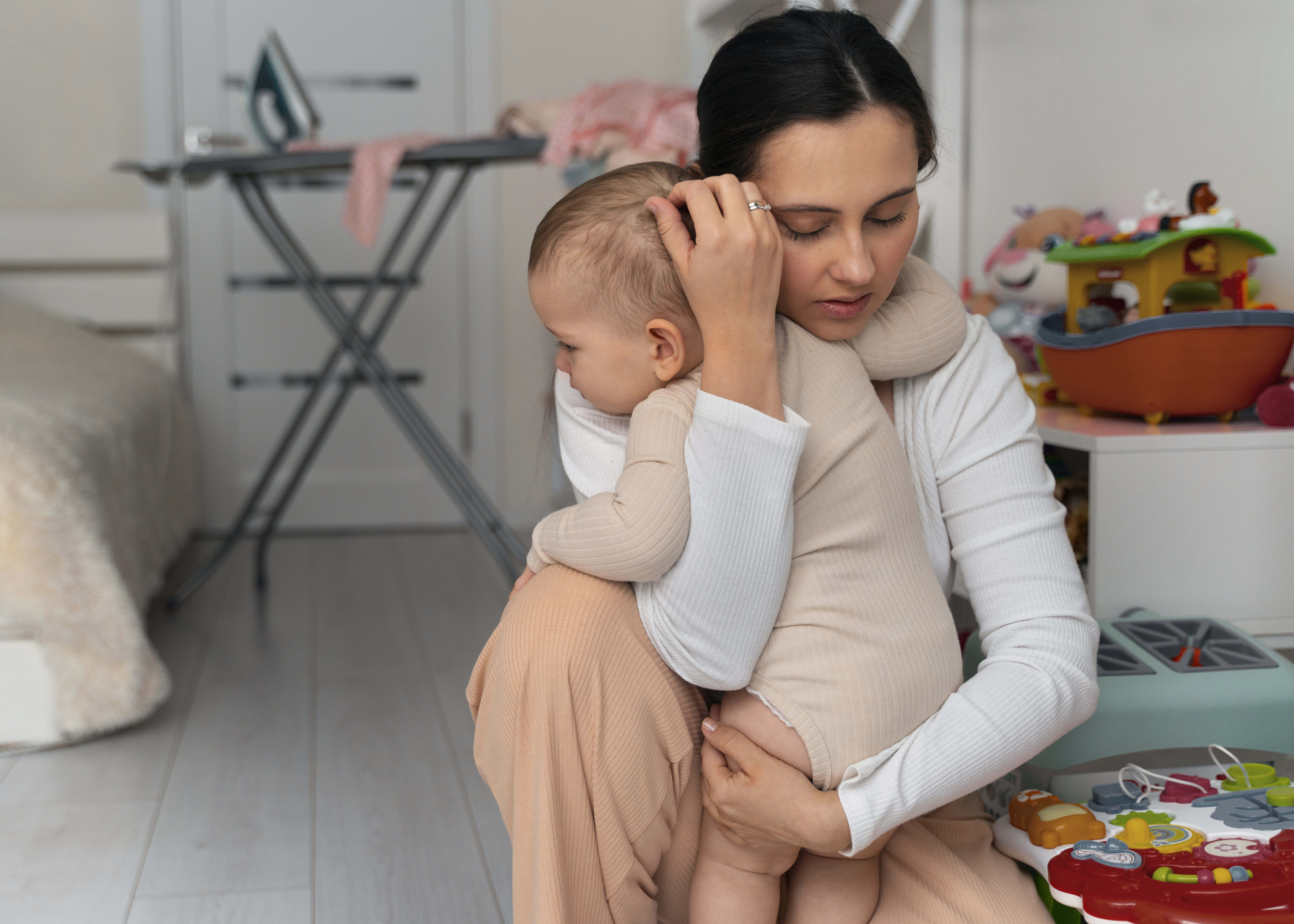 Woman a hugging a baby