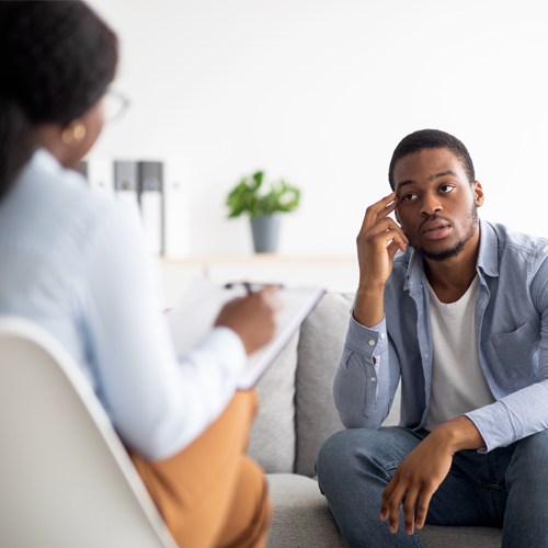 Man speaking to a mental health provider