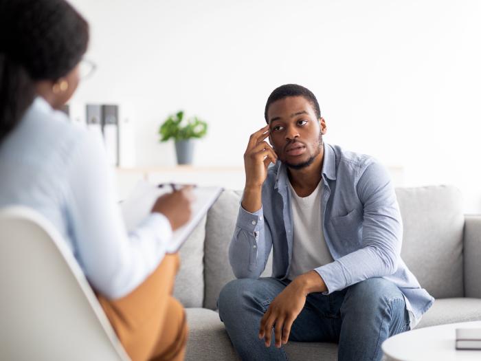 Health worker and patient talking