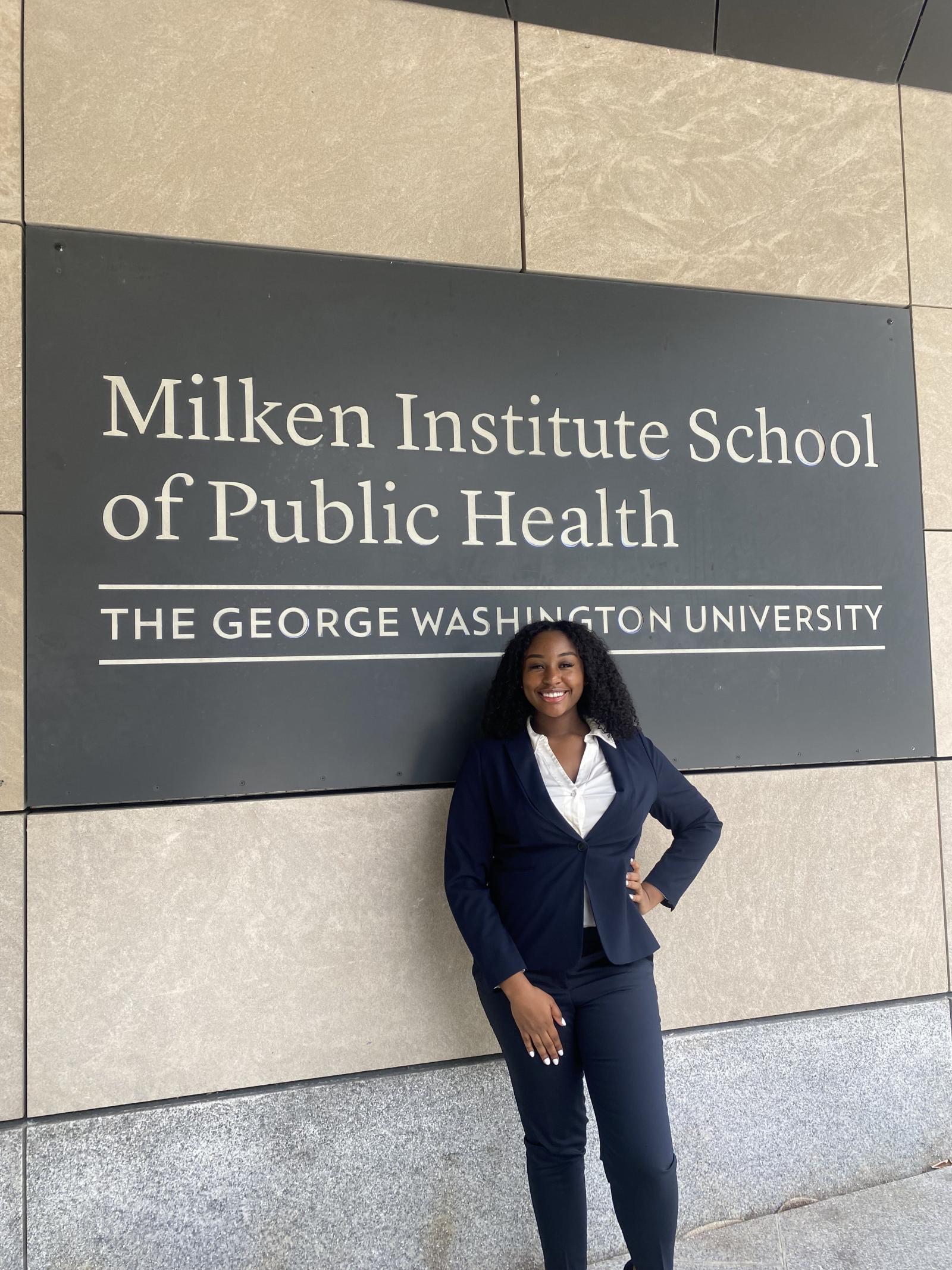 Dymond Hall, student, standing outside the Milken building