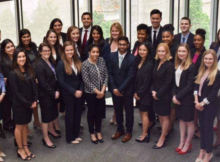 group of people posing in business attire 