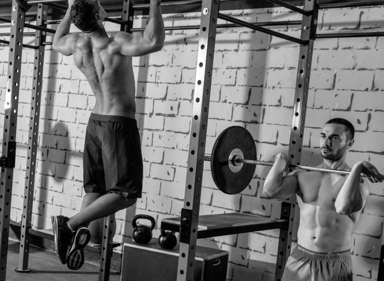 Two men working out in a gym