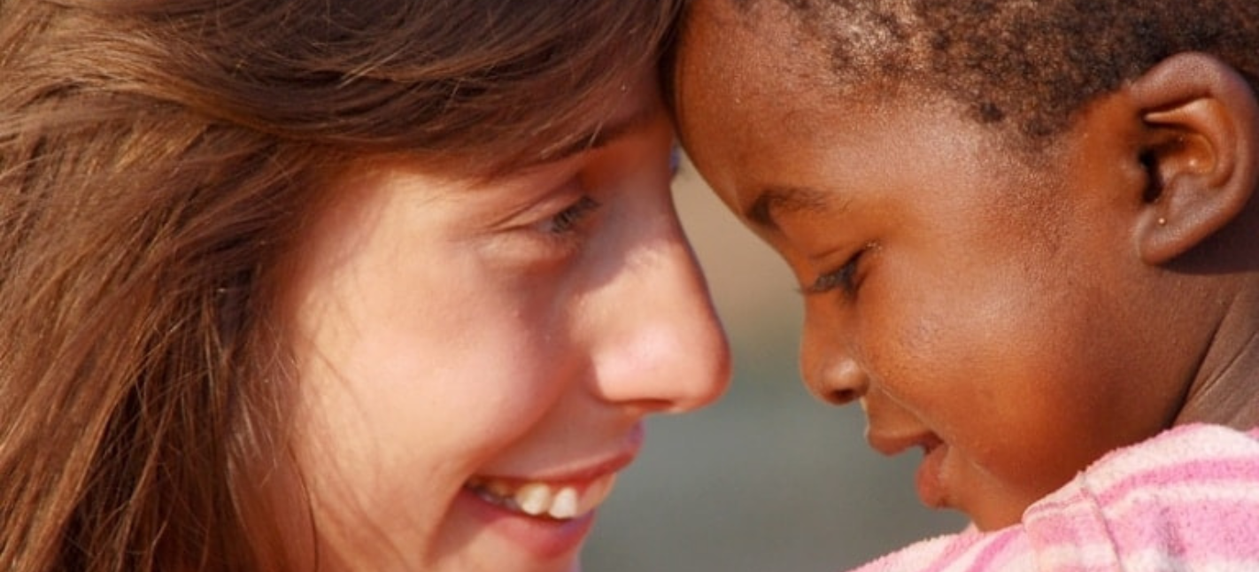 Women embracing a small child