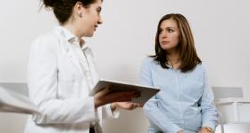 Health care worker talking with a patient