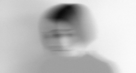 Blurry photo of a woman's face
