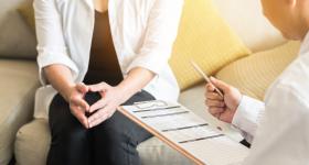 Health care worker talking with a patient