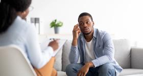 Health worker and patient talking
